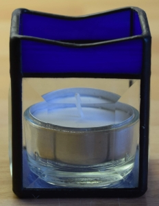 Tea light holder,stained glass,tiffany technique,dark blue,opalescent,with square bevels,clear,size 5,5 x 5,5 x 7,5 cm,manufactured in our own atelier,item number 10027-B.Carmen Harusta,Glasinsel ®,Goettingen,Germany.