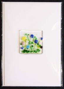 Folding card and envelope,white,ca. 12 x 17 cm,with Glasinsel® motif " Flower Meadow with blue flowers ",ca. 5 x 5 cm,item number 130008w.Carmen Harusta,Glasinsel ®,Göttingen,Germany.