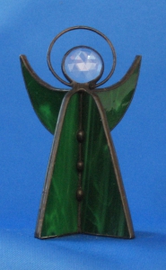 Standing angel,stained glass,dark green,opalescent,with faceted glass stone,clear,height ca. 9,5 cm,item number 30039E,manufactured in our own atelier.Carmen Harusta,Glasinsel ®,Goettingen,Germeny (front view).