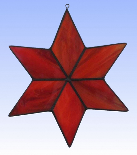 Suncatcher " Star ",stained glass,red,light orange,opalescent,diameter ca. 13 cm,item number 30074A,manufactured in our own atelier.Carmen Harusta,Glasinsel ®,Goettingen,Germany.