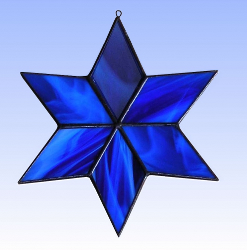 Suncatcher " Star ",stained glass,dark blue,blue,opalescent,diameter ca. 13 cm,item number 30074B,manufactured in our own atelier.Carmen Harusta,Glasinsel ®,Goettingen,Germany.