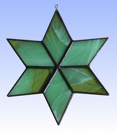Suncatcher " Star ",stained glass,green,pastel green,opalescent,diameter ca. 13 cm,item number 30074D,manufactured in our own atelier.Carmen Harusta,Glasinsel ®,Goettingen,Germany.