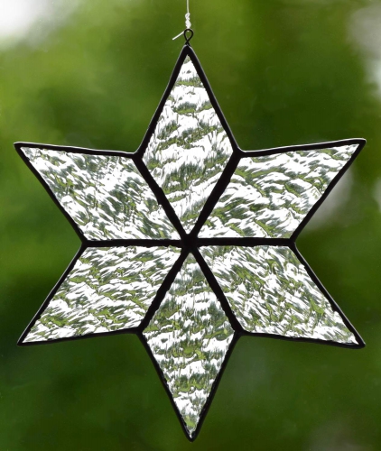 Suncatcher " Star ",tiffany technique,clear texture glass,granite,diameter ca. 13 cm,item number 30074G,manufactured in our own atelier.Carmen Harusta,Glasinsel ®,Goettingen,Germany.