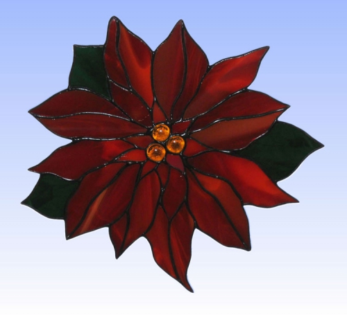 Suncatcher " Christmas Star ",stained glass,dark red,dark green,opalescent,orange,transparent,diameter ca. 21 cm,item number 30081,manufactured in our own atelier.Carmen Harusta,Glasinsel ®,Goettingen,Germany.