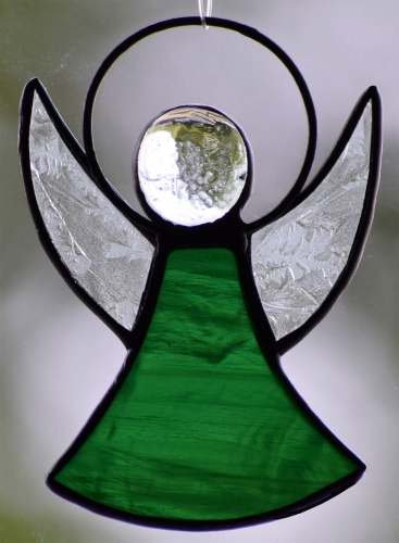 Guardian Angel,stained glass;dress: dark green,semi transparent;wings: glue chip glass,clear;head: glass nugget,clear,size ca. 7 x 5 cm,manufactured in our own atelier,item number 30060I.Carmen Harusta,Glasinsel ®,Goettingen,Germany.