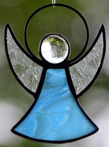 Guardian Angel,stained glass;dress: light blue,white,semi transparent,wings: glue chip glass,clear;head: glass nugget,clear,size ca. 7 x 5 cm,manufactured in our own atelier,item number 30060J.Carmen Harusta,Glasinsel ®,Goettingen,Germany.