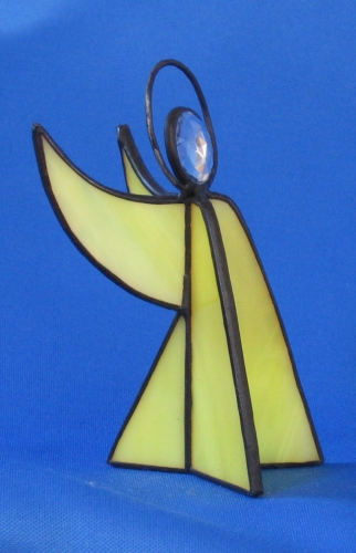 Standing angel,stained glass,yellow,opalescent,with faceted glass stone,clear,height ca. 9,5 cm,item number 30039C,manufactured in our own atelier.Carmen Harusta,Glasinsel ®,Goettingen,Germeny (side view).