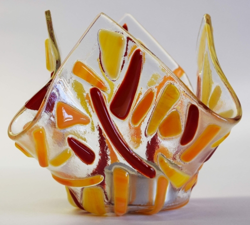 Glass tea light holder,red and orange on clear,height ca. 10 cm,diameter ca. 15 cm,manufactured in our own studio,item number FW14.Carmen Harusta,Glasinsel ®,Göttingen,Germany. (image 1).
